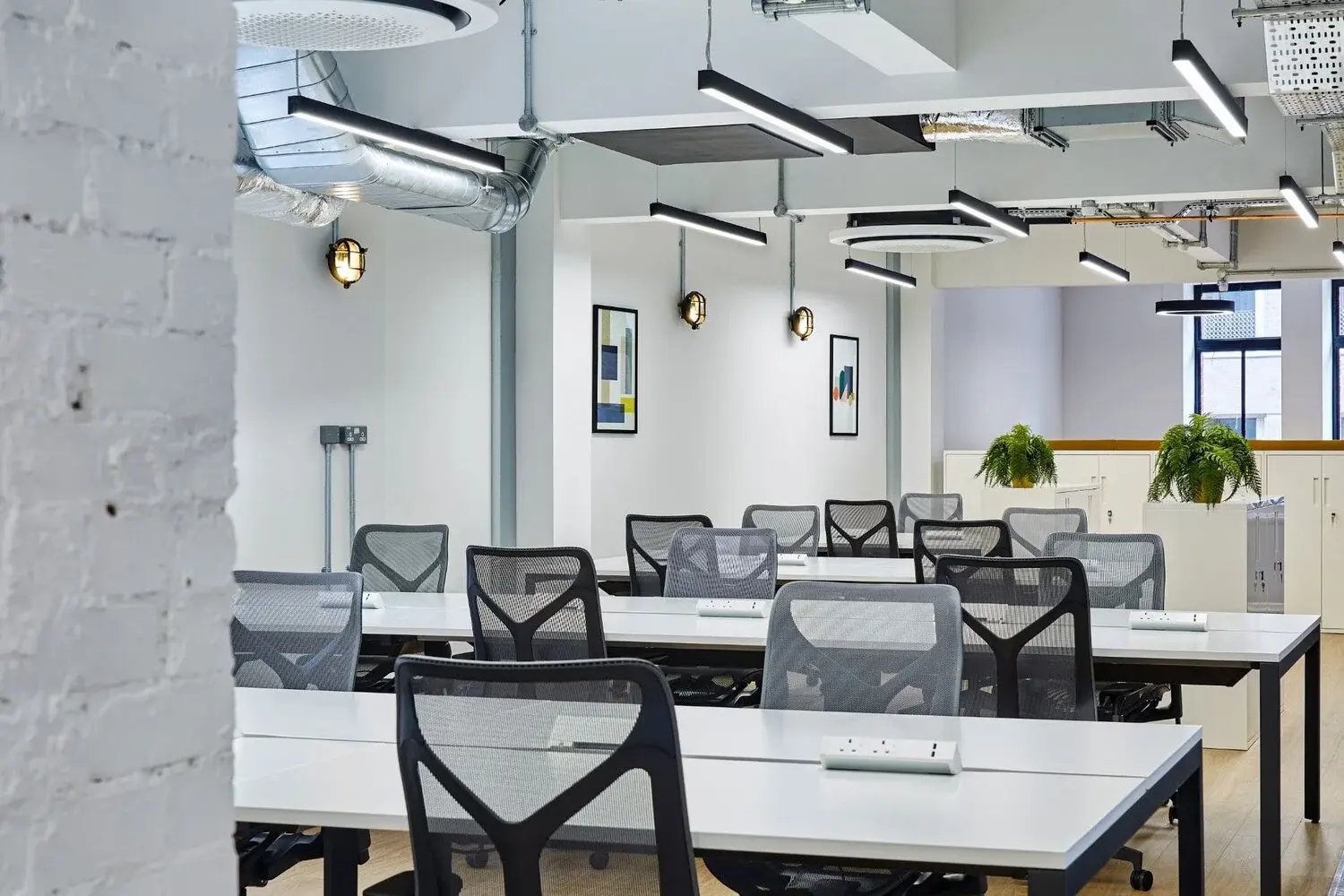 Suspended linear lighting in an office