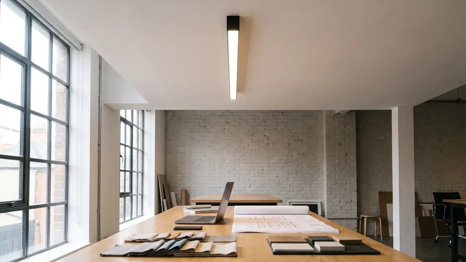 Surface-mounted linear lighting for exposed ceilings and refurbishments